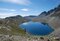 lago grande di viso con intorno la catena del Monviso, cielo azzurro